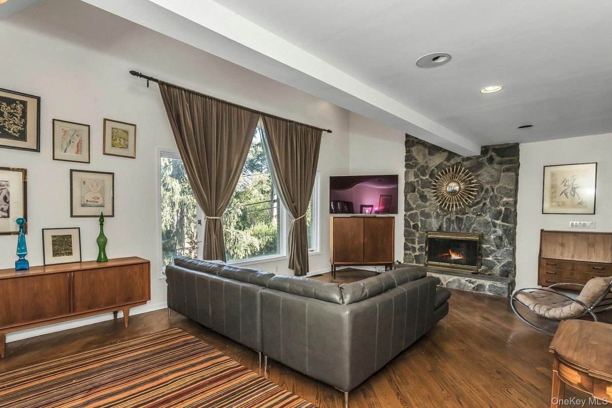 Fireplace, Interior, Living room, Recessed Lighting, Stone Walls, Wood Texture Flooring