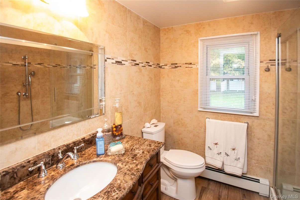 Bathroom, Dual Sink Vanities, Glass Shower, Interior, Wood Texture Flooring