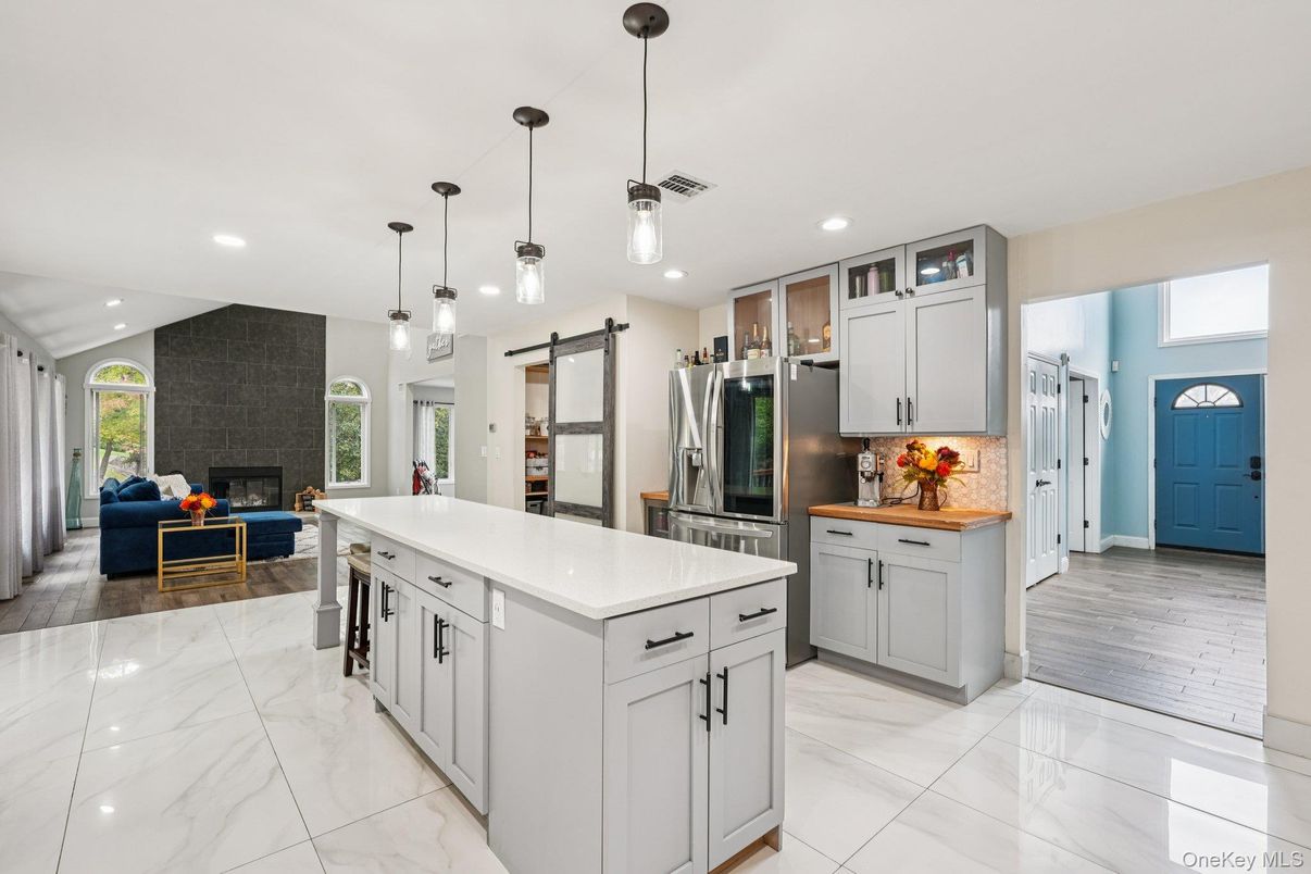 Fireplace, Interior, Kitchen, Living room, Marble, Pendant Lights, Recessed Lighting, Stainless Steel Appliances