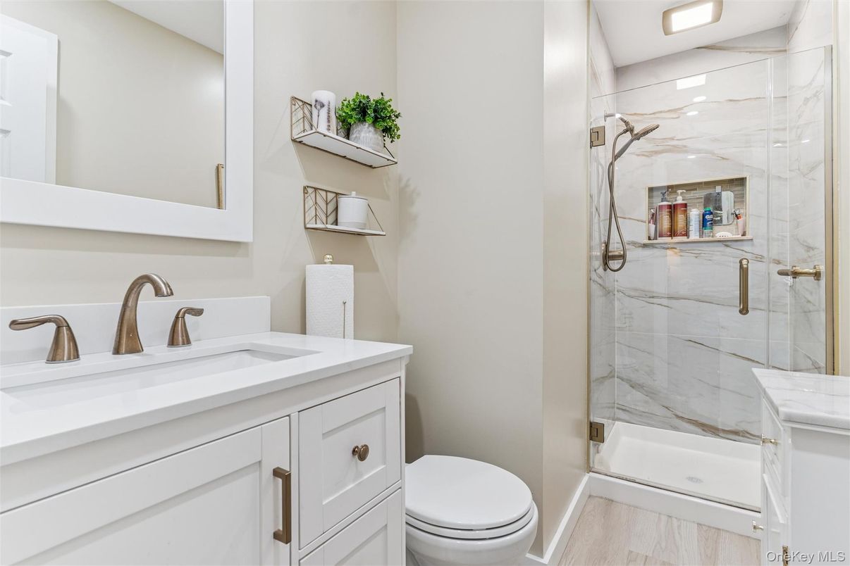 Bathroom, Glass Shower, Interior, Marble Walls, Wood Texture Flooring