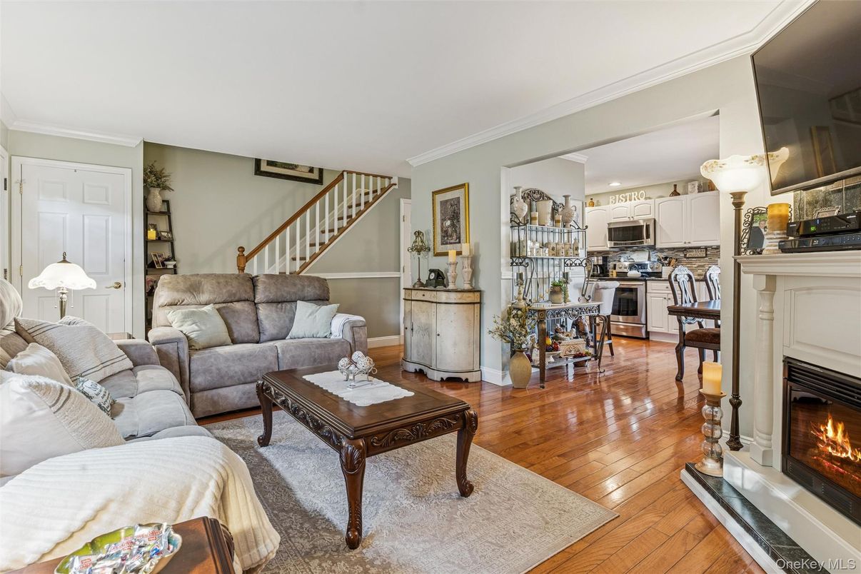 Dining room, Fireplace, Interior, Kitchen, Living room, Stainless Steel Appliances, Wood Texture Flooring