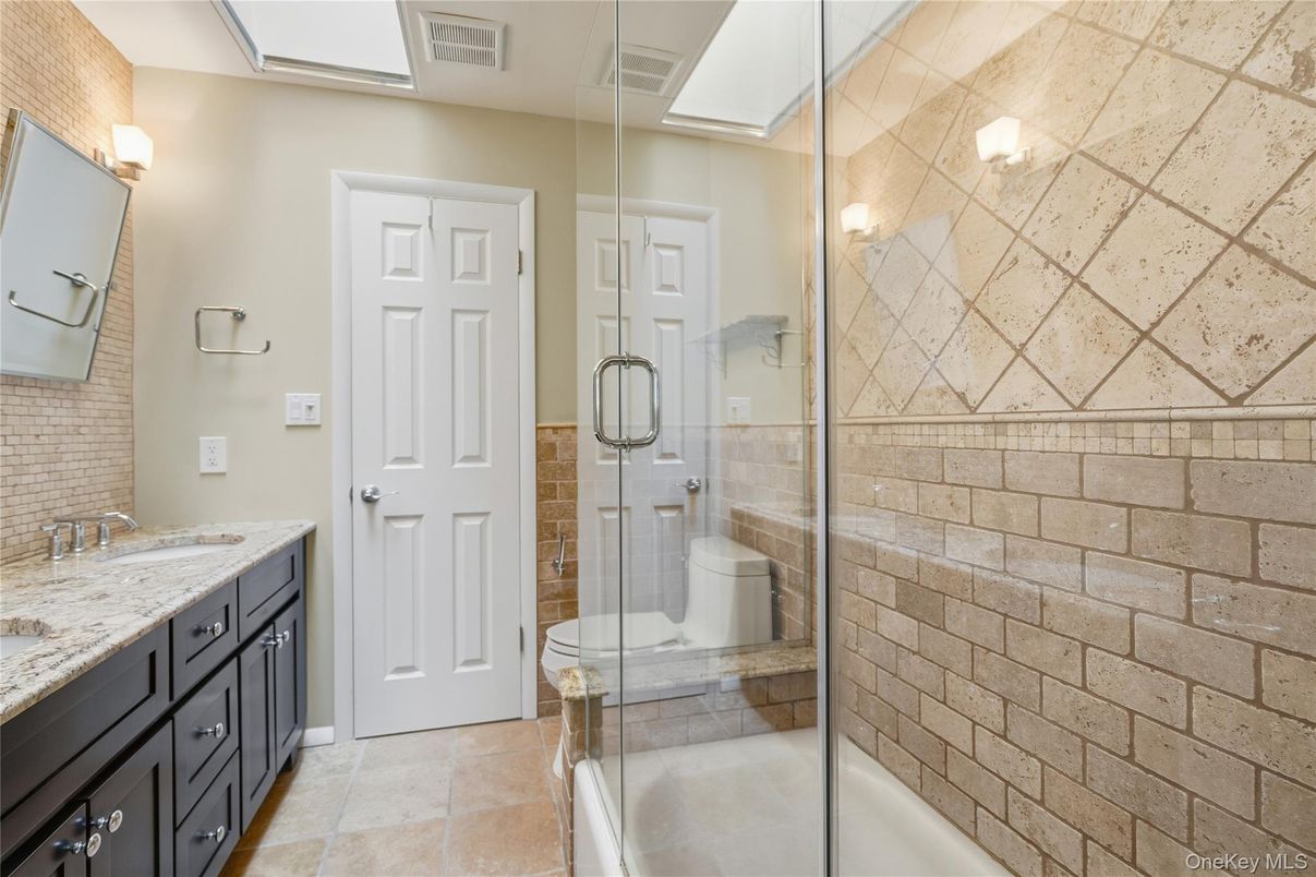 Bathroom, Dual Sink Vanities, Glass Shower, Interior, Stone Walls