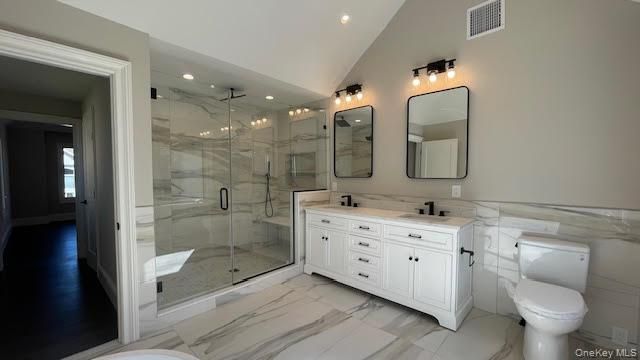 Bathroom, Dual Sink Vanities, Glass Shower, Interior, Marble, Marble Walls, Recessed Lighting