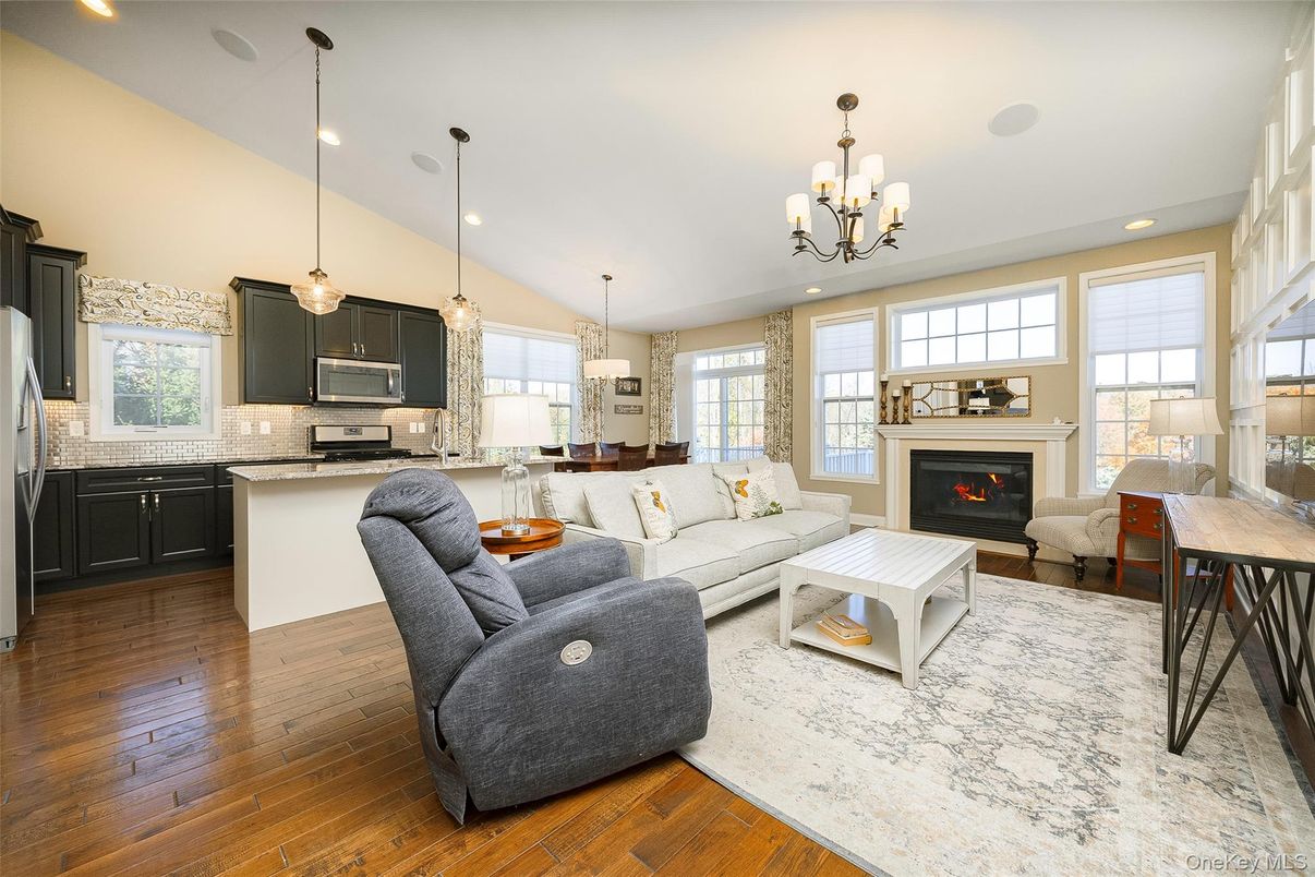 Chandelier, Fireplace, Interior, Kitchen, Living room, Pendant Lights, Recessed Lighting, Wood Texture Flooring