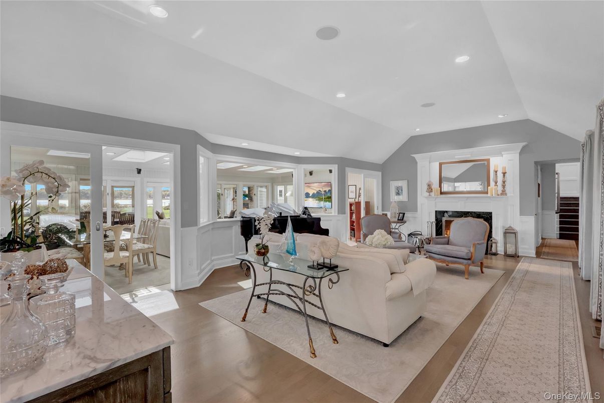 Dining room, Fireplace, Interior, Living room, Piano, Recessed Lighting, Wood Texture Flooring