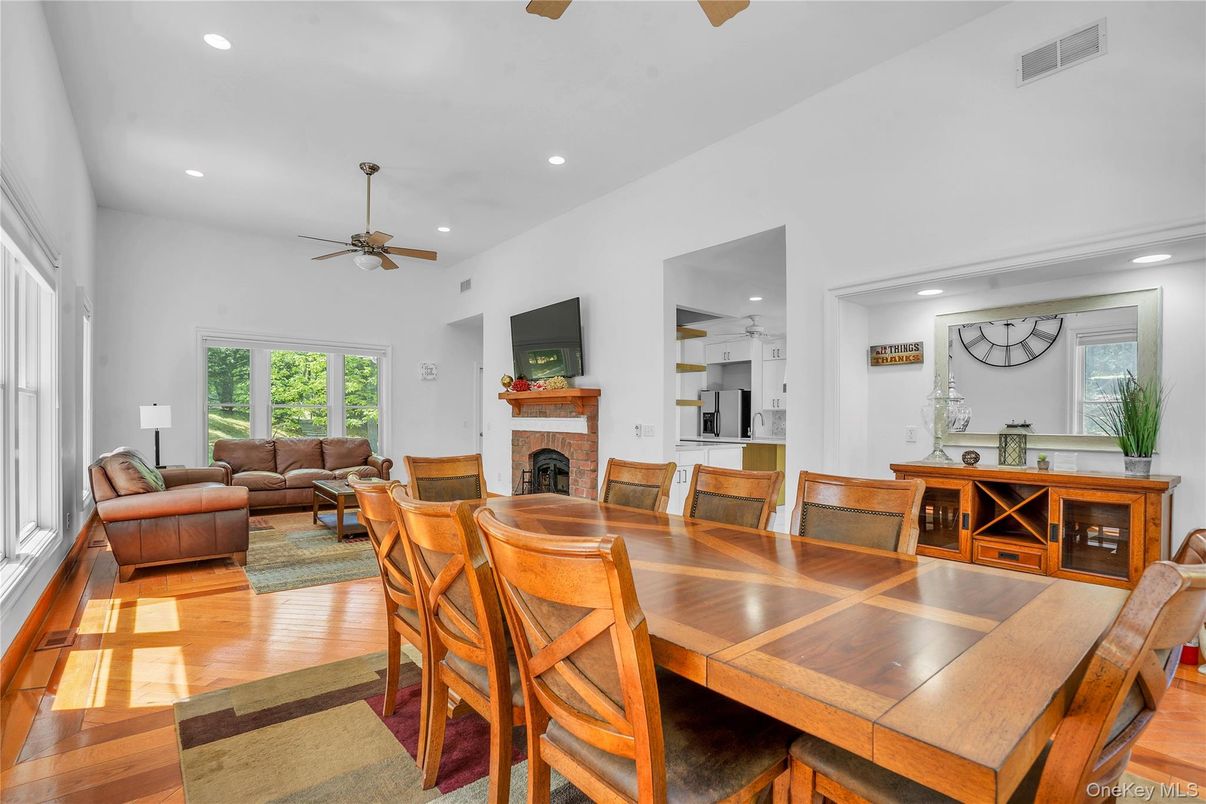 Dining room, Fireplace, Interior, Living room, Recessed Lighting, Wood Texture Flooring