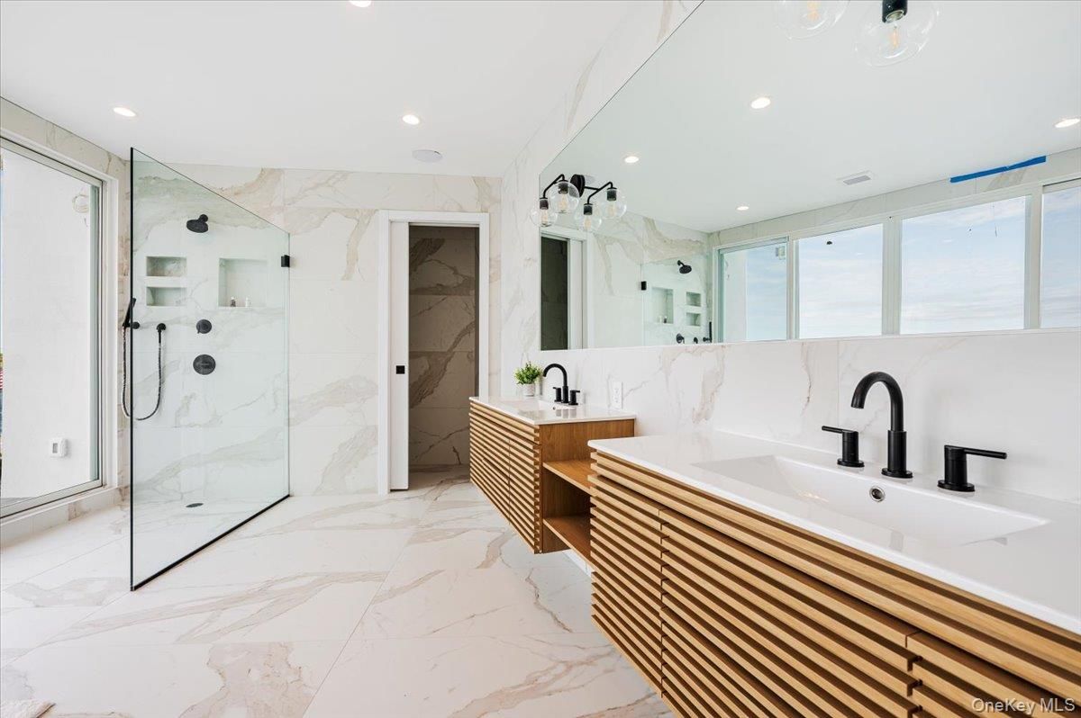Bathroom, Dual Sink Vanities, Glass Shower, Interior, Marble, Marble Walls, Recessed Lighting