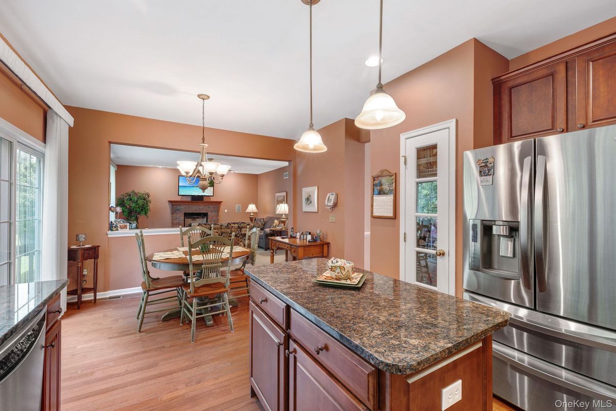 Chandelier, Dining room, Interior, Kitchen, Pendant Lights, Recessed Lighting, Stainless Steel Appliances, Wood Texture Flooring