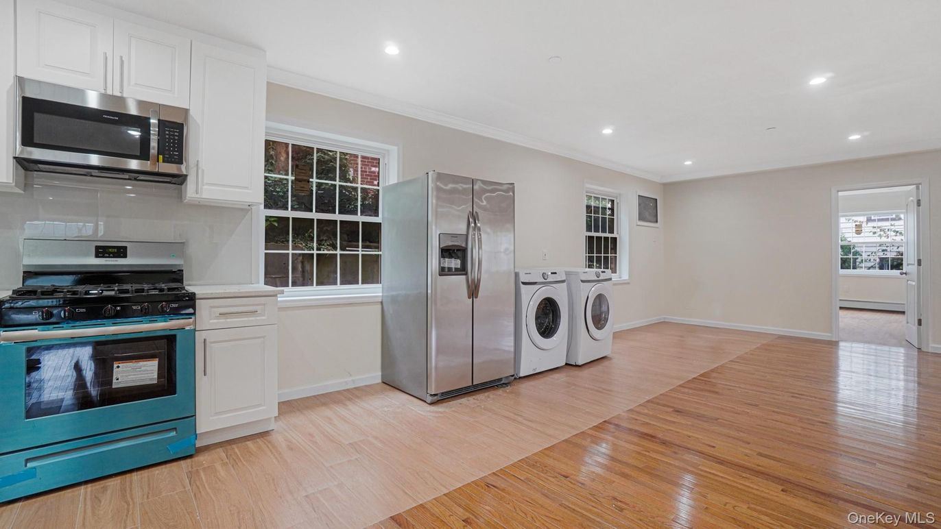 Interior, Kitchen, Recessed Lighting, Stainless Steel Appliances, Washer, Wood Texture Flooring