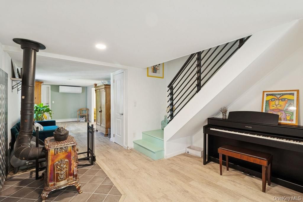 Fireplace, Interior, Piano, Recessed Lighting, Wood Texture Flooring