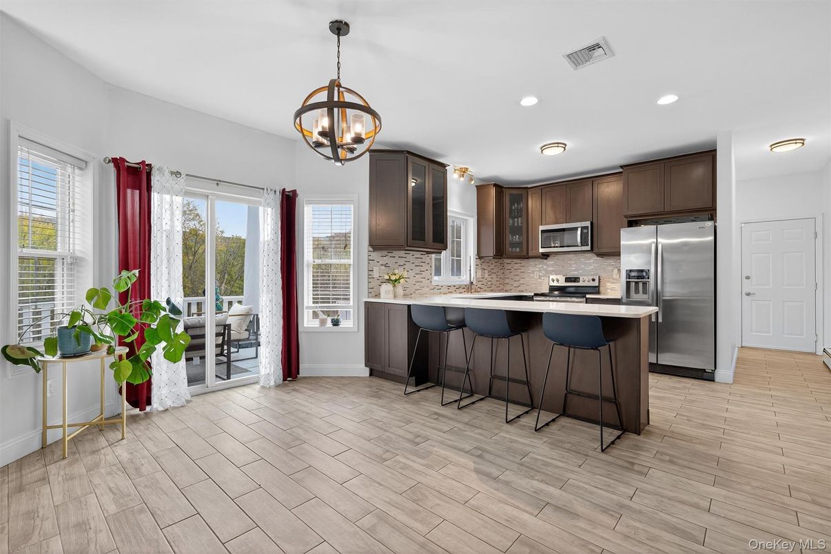 Chandelier, Interior, Kitchen, Pendant Lights, Recessed Lighting, Stainless Steel Appliances, Wood Texture Flooring
