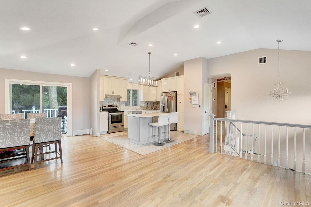 Chandelier, Dining room, Interior, Kitchen, Pendant Lights, Recessed Lighting, Stainless Steel Appliances, Wood Texture Flooring