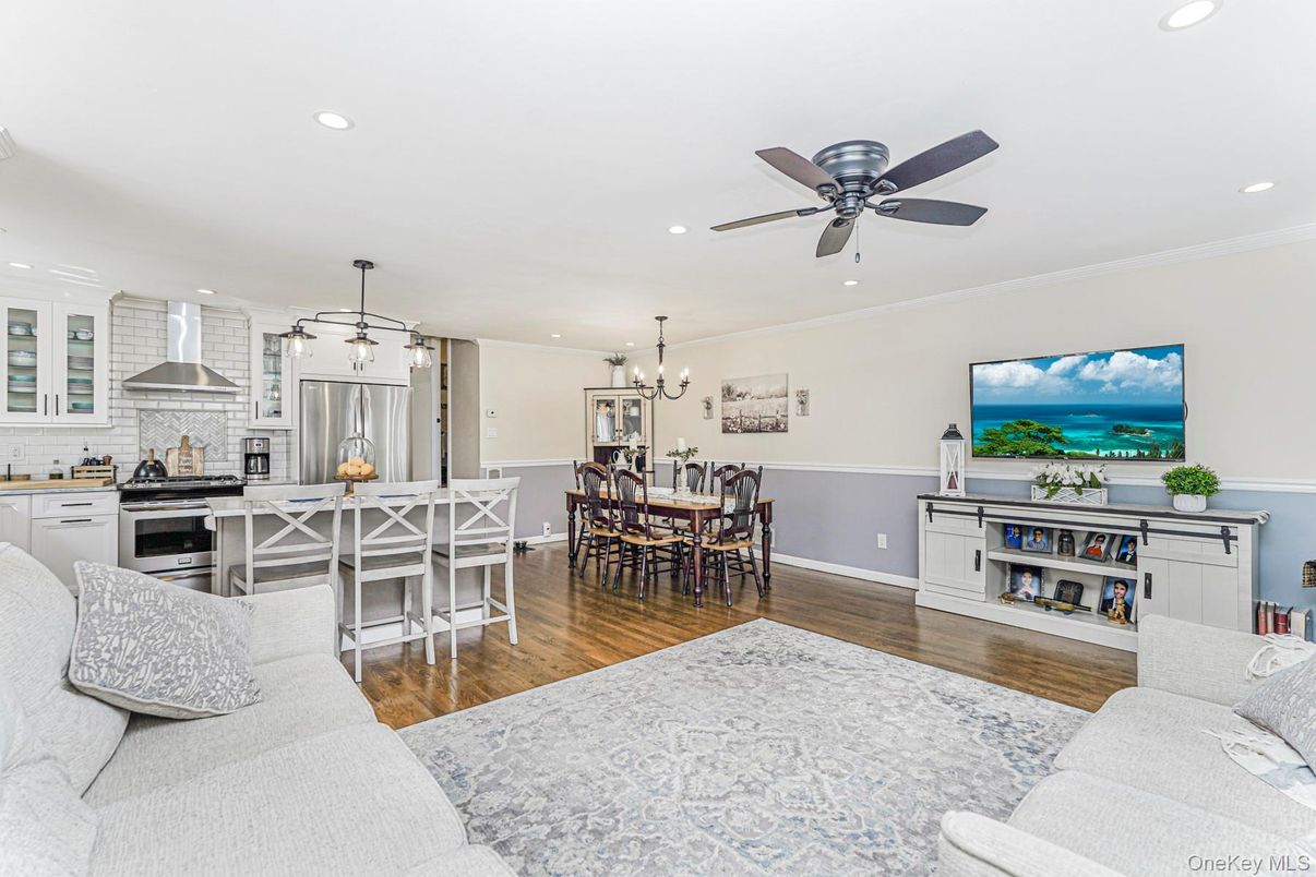 Chandelier, Dining room, Interior, Kitchen, Living room, Pendant Lights, Recessed Lighting, Stainless Steel Appliances, Water, Wood Texture Flooring