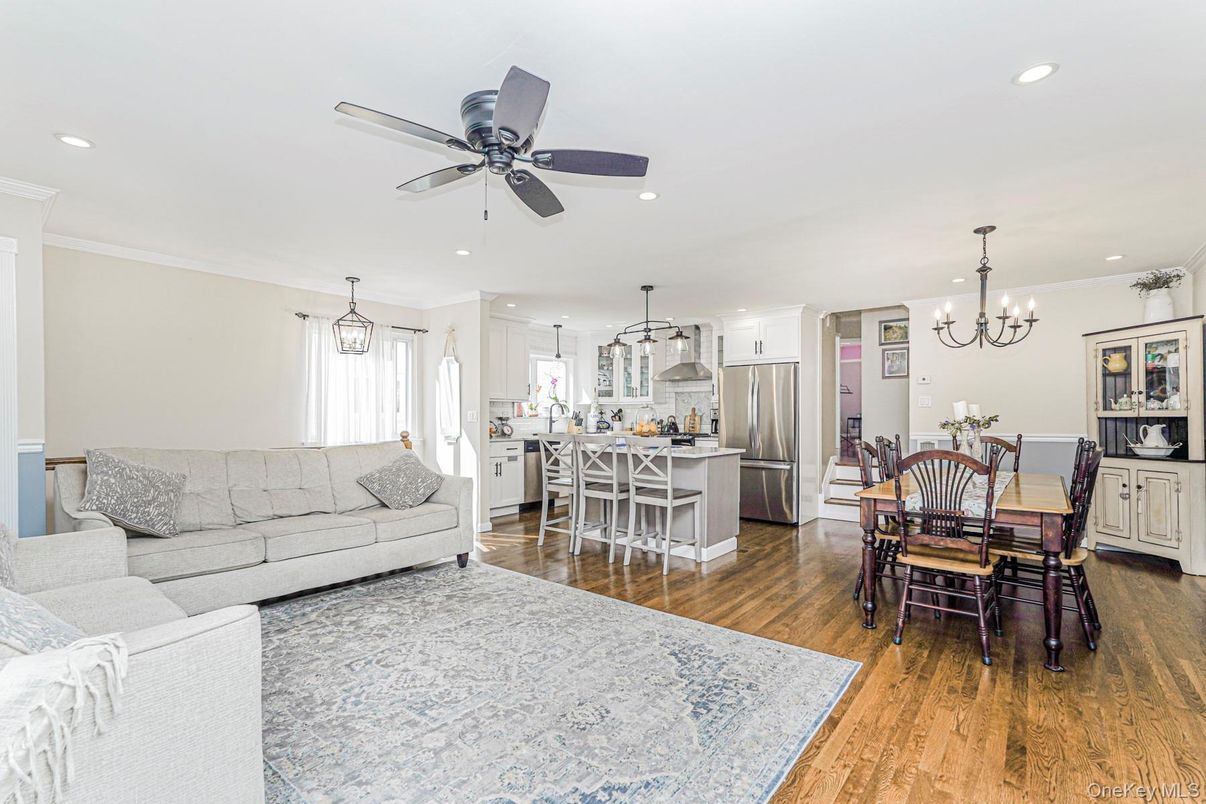 Chandelier, Dining room, Interior, Kitchen, Living room, Pendant Lights, Recessed Lighting, Stainless Steel Appliances, Wood Texture Flooring