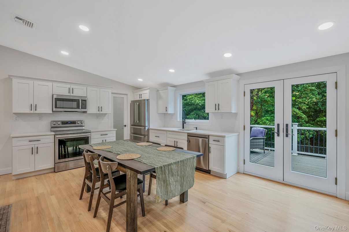 Dining room, Interior, Kitchen, Recessed Lighting, Stainless Steel Appliances, Wood Texture Flooring