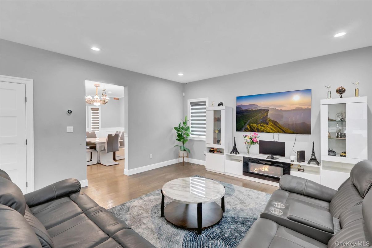 Chandelier, Dining room, Fireplace, Interior, Living room, Recessed Lighting, Wood Texture Flooring