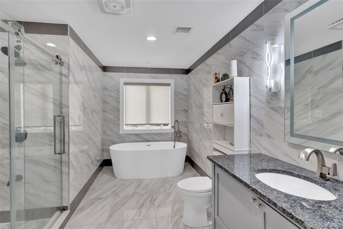 Bathroom, Dual Sink Vanities, Free Standing Baths, Glass Shower, Interior, Marble, Marble Walls, Recessed Lighting