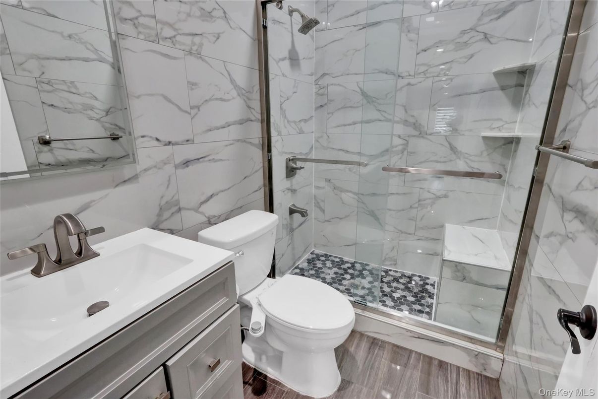 Bathroom, Glass Shower, Interior, Marble Walls, Wood Texture Flooring