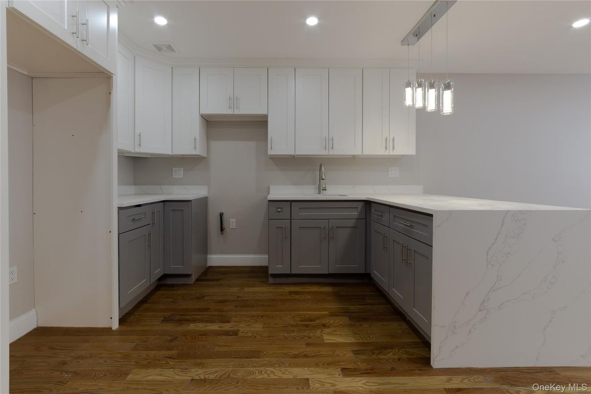 Interior, Kitchen, Marble Walls, Pendant Lights, Recessed Lighting, Wood Texture Flooring