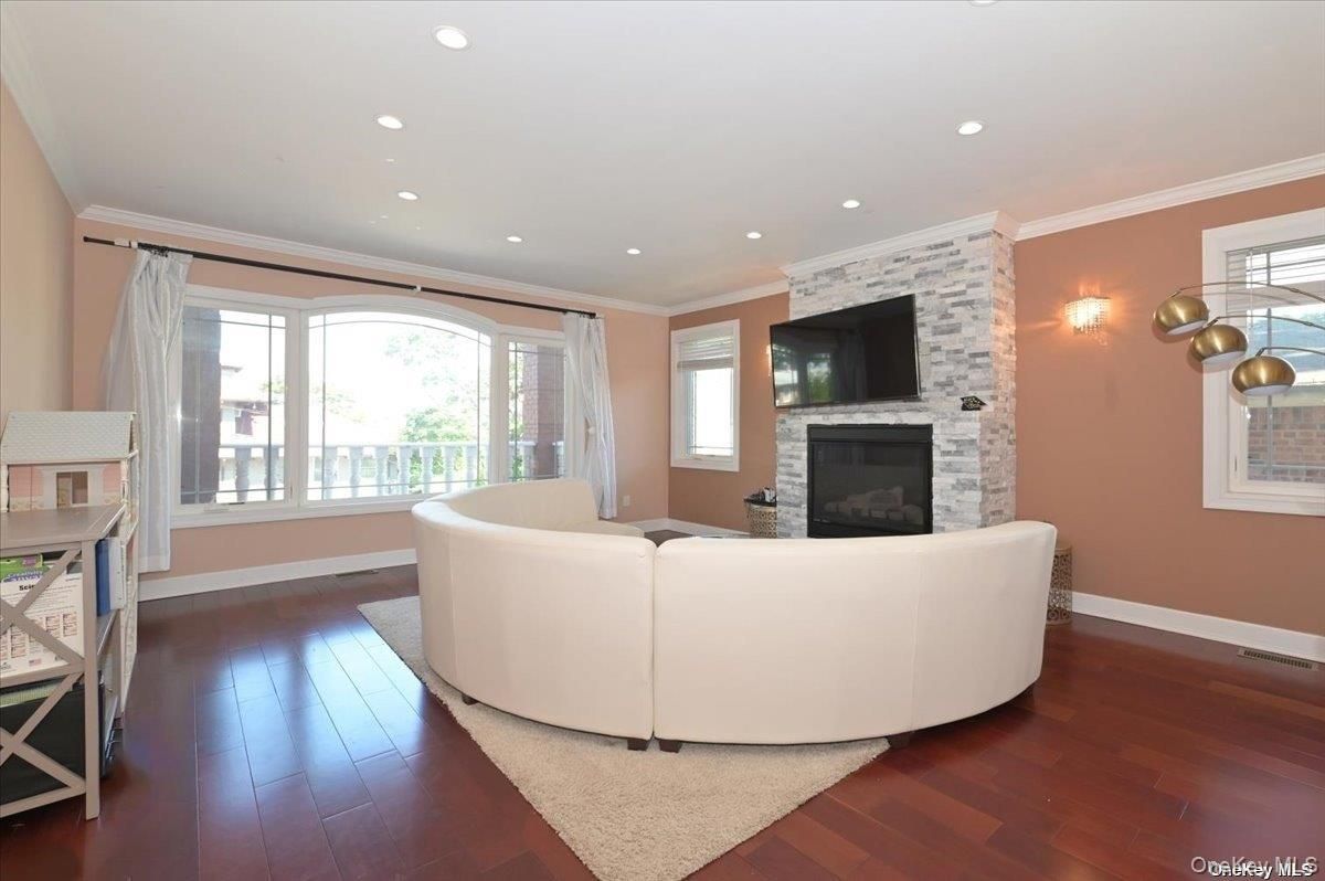 Fireplace, Interior, Living room, Recessed Lighting, Stone Walls, Wood Texture Flooring