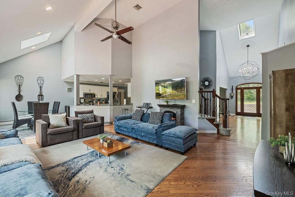 Chandelier, Dining room, Fireplace, Interior, Living room, Recessed Lighting, Wood Texture Flooring