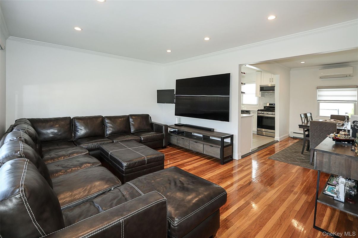 Dining room, Interior, Kitchen, Living room, Recessed Lighting, Stainless Steel Appliances, Wood Texture Flooring