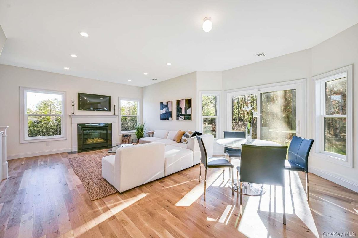 Dining room, Fireplace, Interior, Living room, Recessed Lighting, Wood Texture Flooring