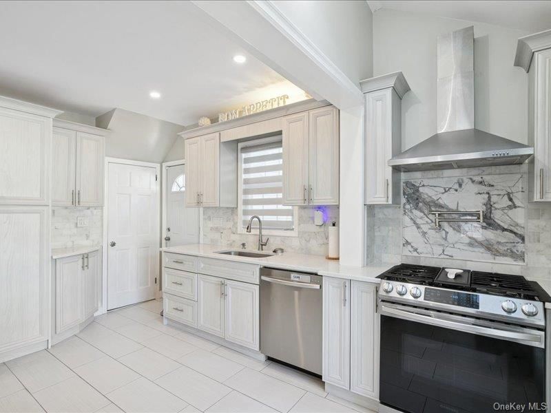 Interior, Kitchen, Marble Walls, Recessed Lighting, Stainless Steel Appliances