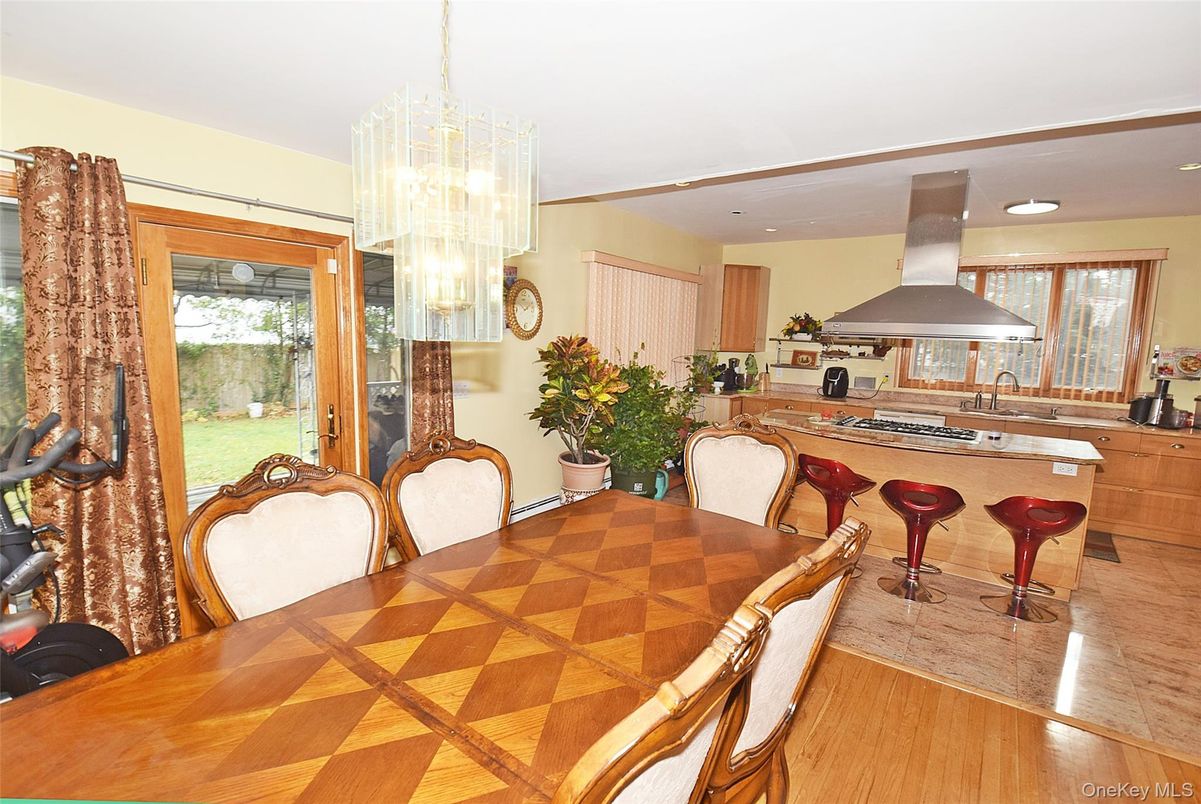 Chandelier, Dining room, Fireplace, Interior, Kitchen, Recessed Lighting, Wood Texture Flooring