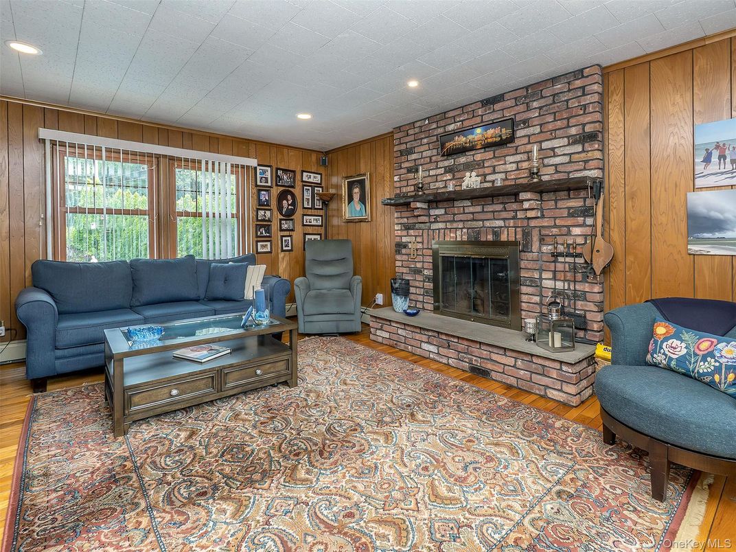 Fireplace, Interior, Living room, Recessed Lighting, Stone Walls, Wood Texture Flooring, Wooden Walls