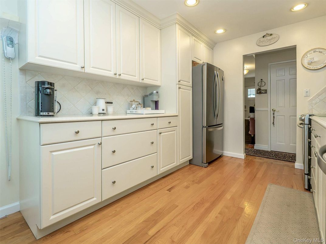 Interior, Kitchen, Recessed Lighting, Washer, Wood Texture Flooring