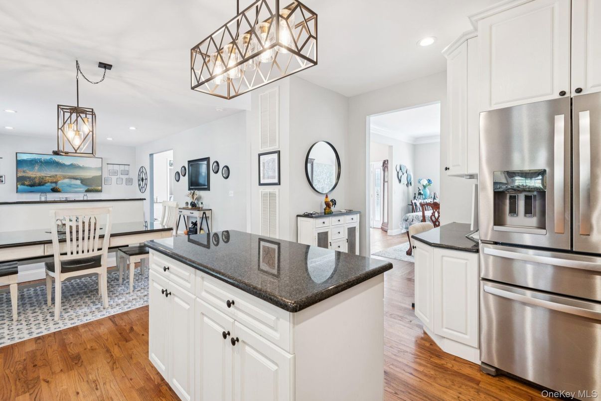 Dining room, Interior, Kitchen, Pendant Lights, Recessed Lighting, Stainless Steel Appliances, Wood Texture Flooring