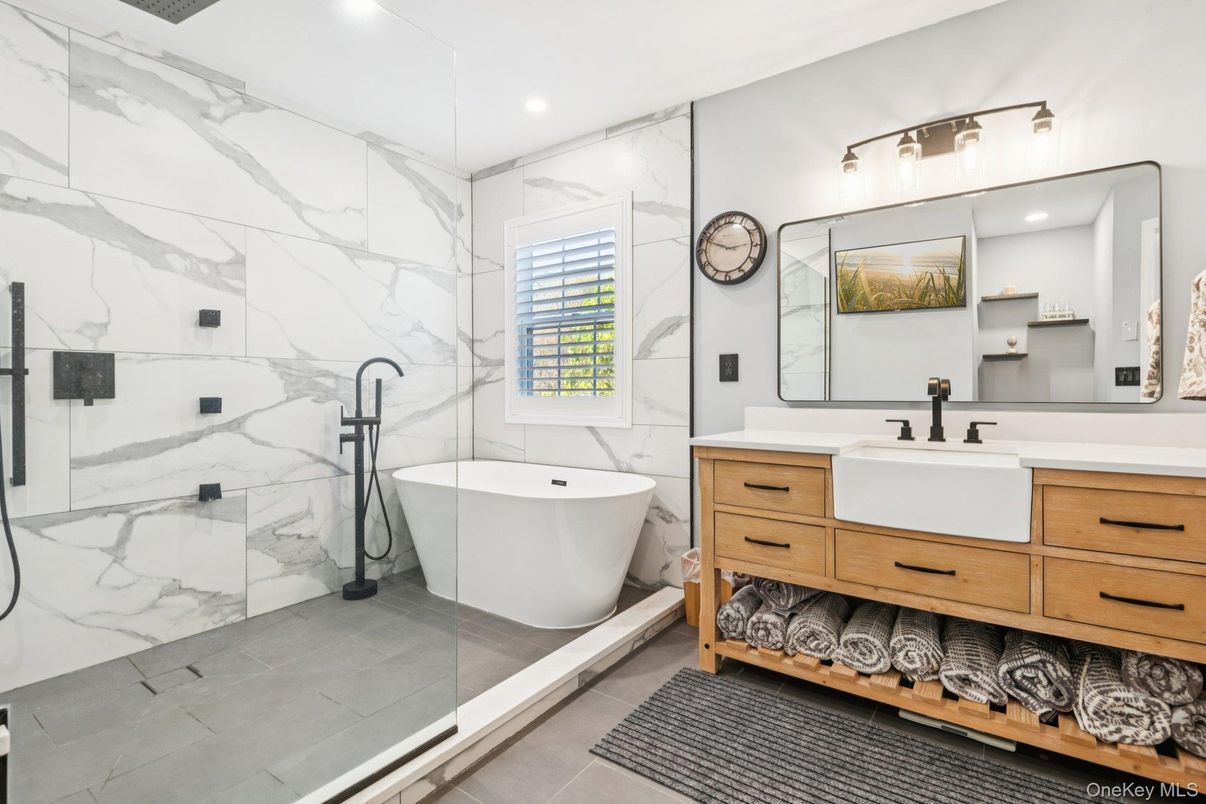 Bathroom, Dual Sink Vanities, Free Standing Baths, Glass Shower, Interior, Marble Walls, Recessed Lighting