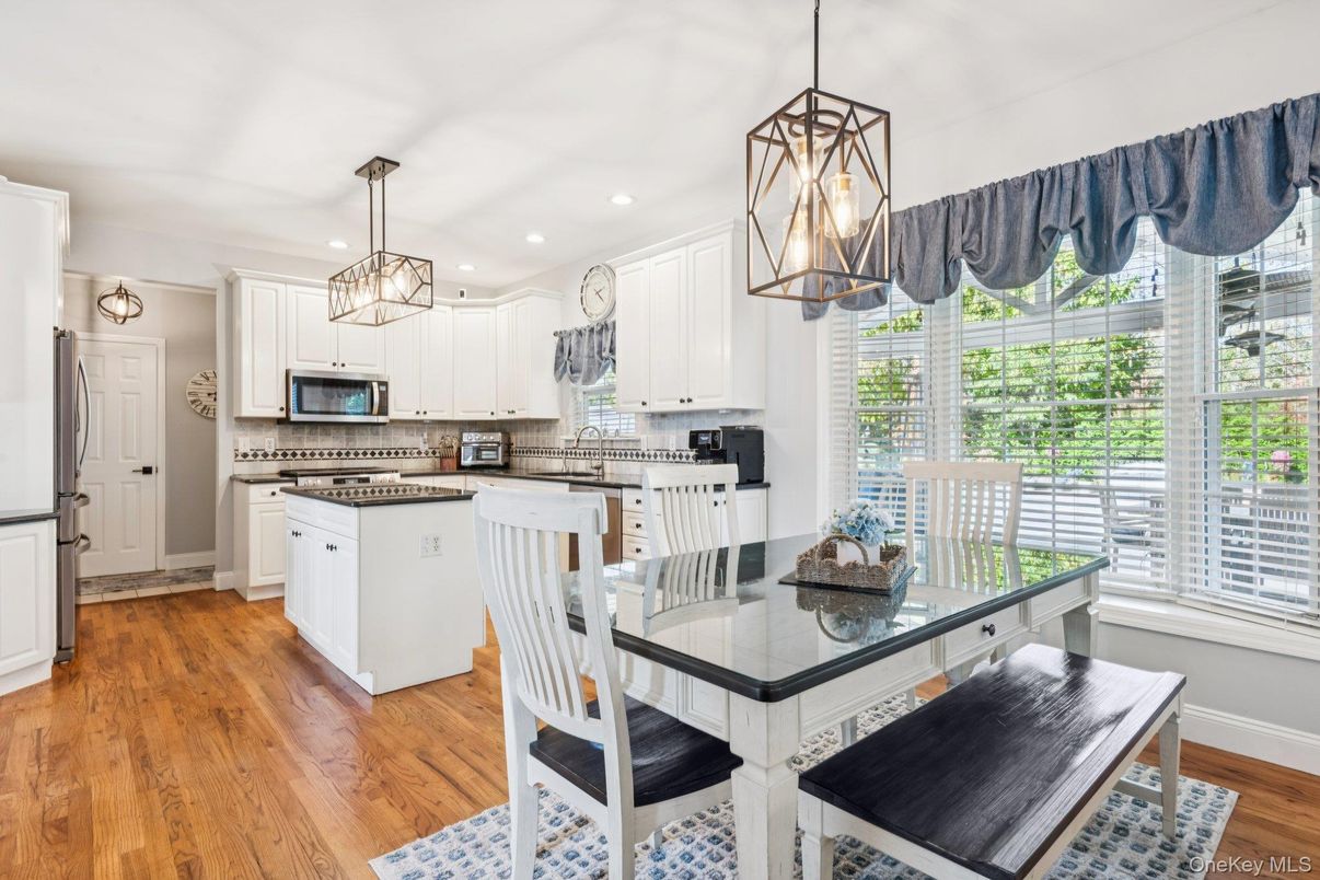 Dining room, Interior, Kitchen, Pendant Lights, Recessed Lighting, Stainless Steel Appliances, Wood Texture Flooring