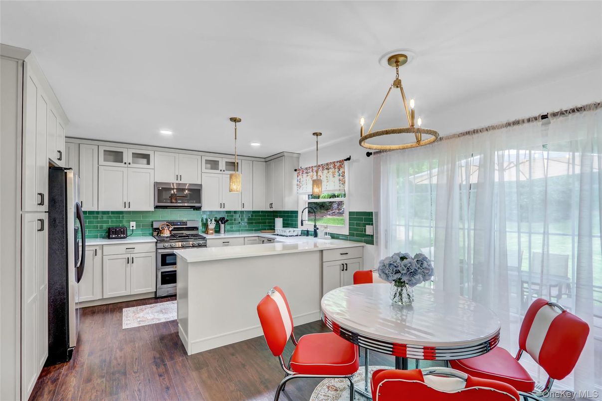Dining room, Interior, Kitchen, Pendant Lights, Recessed Lighting, Stainless Steel Appliances, Wood Texture Flooring