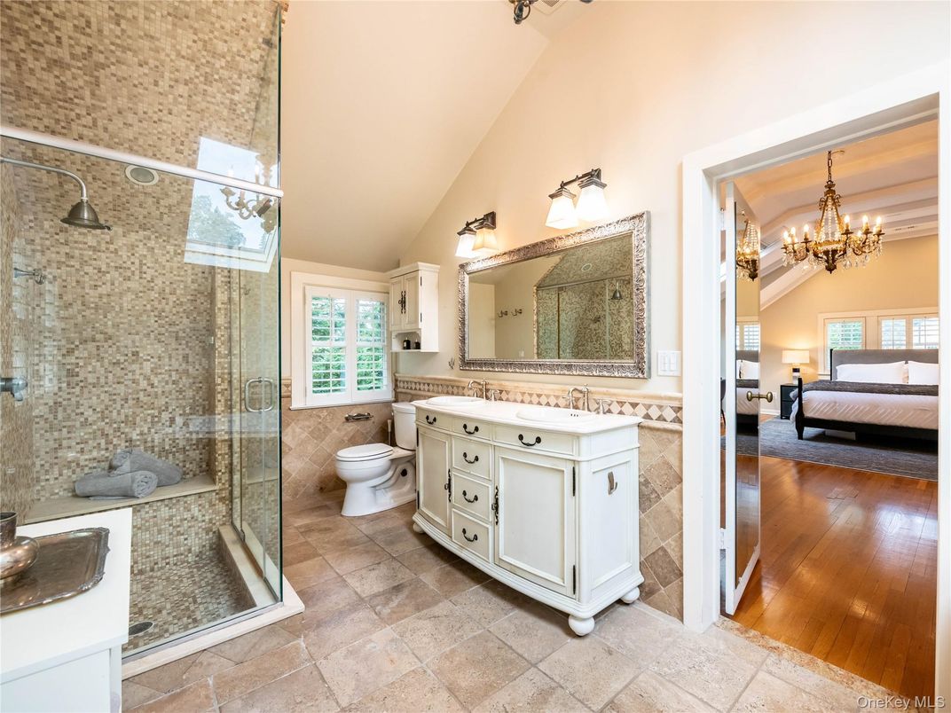 Bathroom, Bedroom, Chandelier, Dual Sink Vanities, Glass Shower, Interior, Wood Texture Flooring