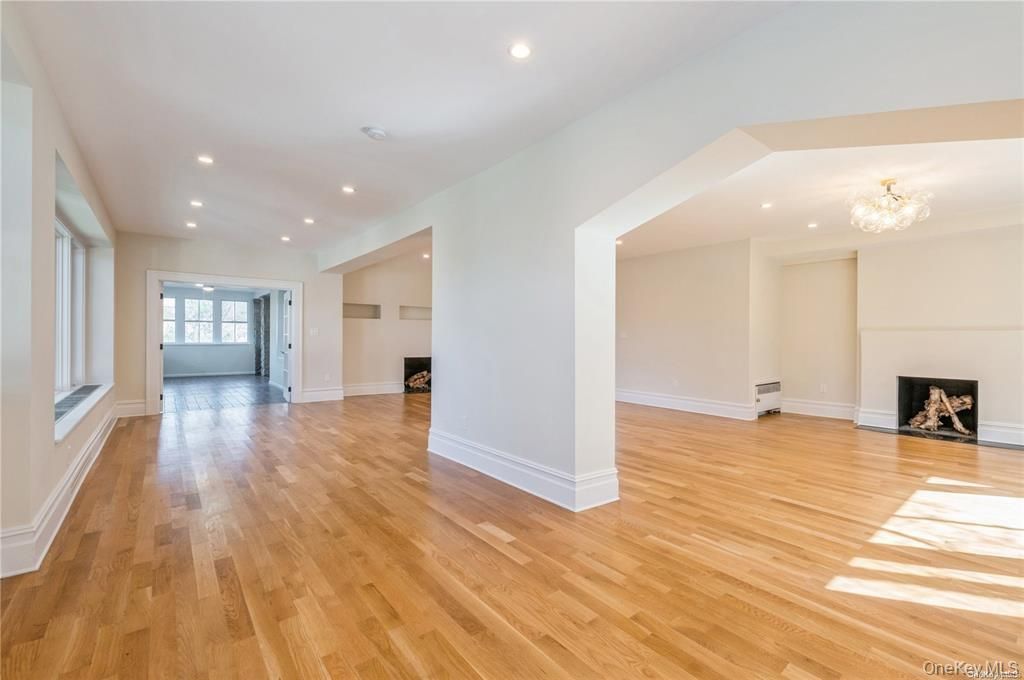Chandelier, Empty room, Fireplace, Interior, Recessed Lighting, Wood Texture Flooring