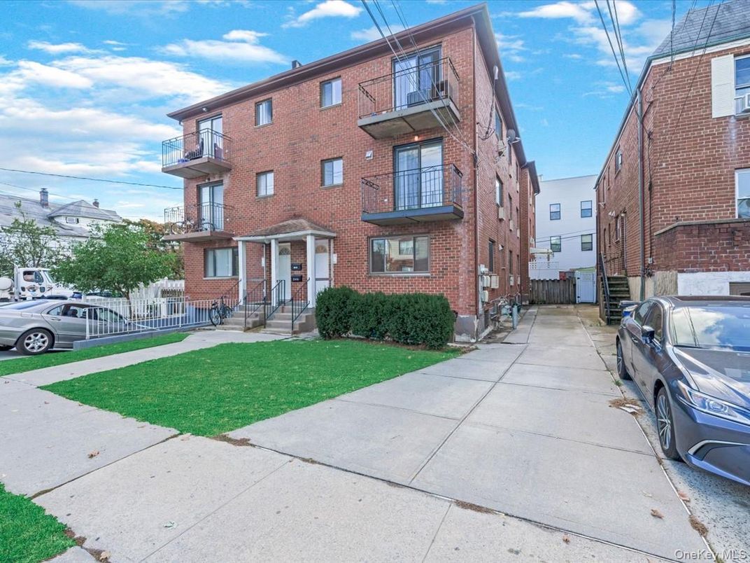 Exterior, Facade, Brick Facade, Condo Building