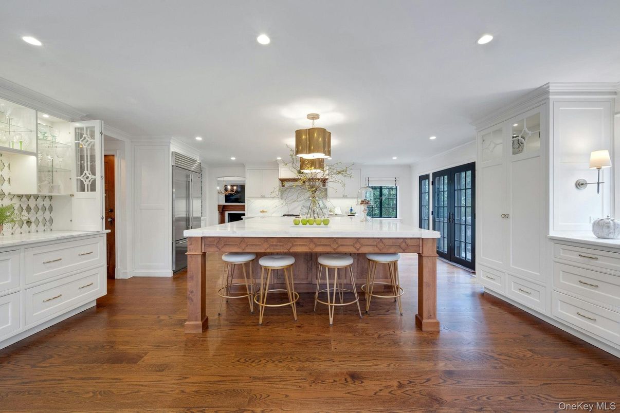 Interior, Kitchen, Marble Walls, Recessed Lighting, Stainless Steel Appliances, Wood Texture Flooring