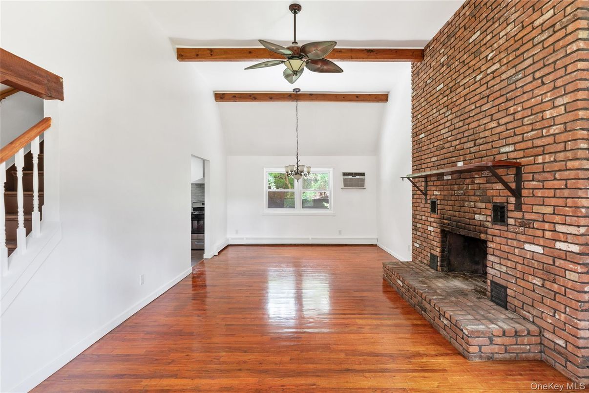 Empty room, Fireplace, Interior, Pendant Lights, Stone Walls, Wooden Beams, Wood Texture Flooring
