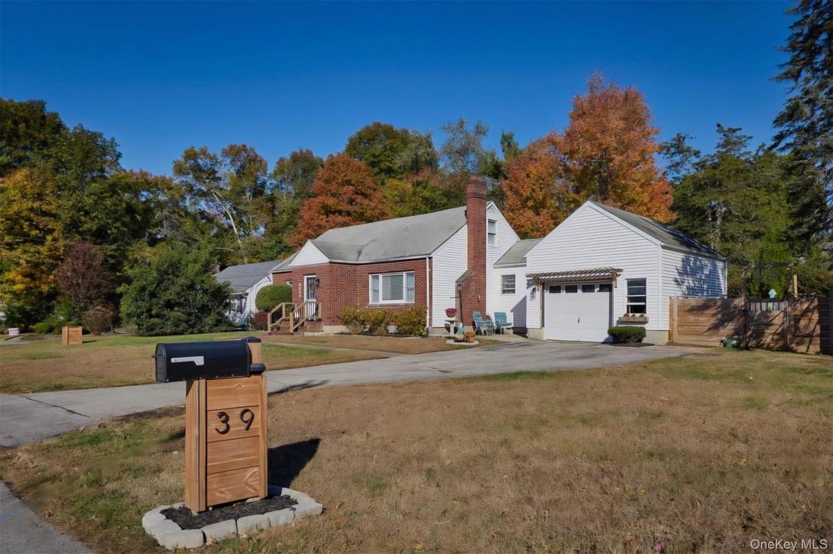 Attached, Backyard, Exterior, Facade, Brick Facade, Cape Cod