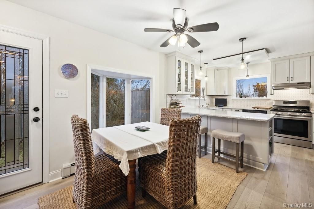 Dining room, Interior, Kitchen, Pendant Lights, Stainless Steel Appliances, Wood Texture Flooring