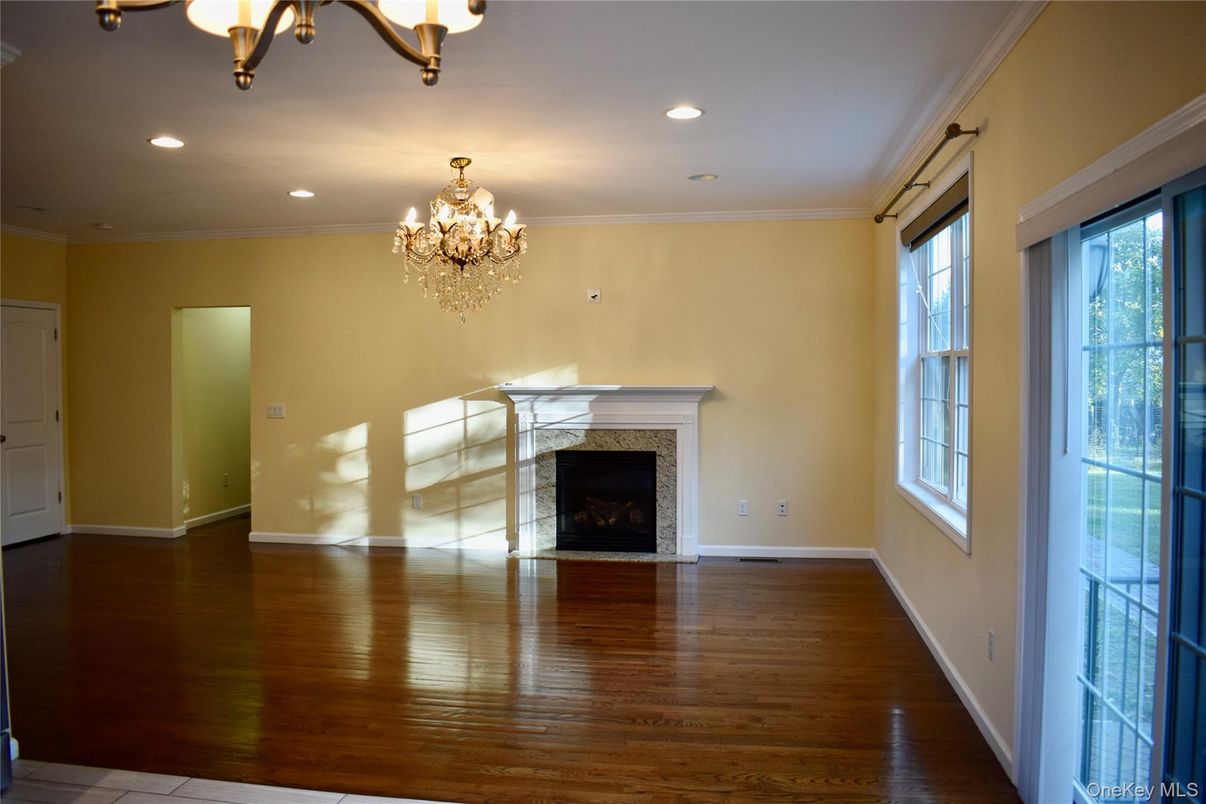 Chandelier, Empty room, Fireplace, Interior, Recessed Lighting, Wood Texture Flooring