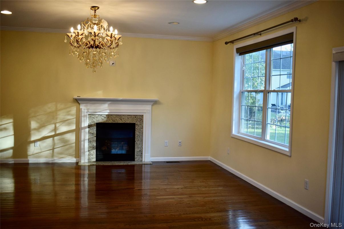 Chandelier, Empty room, Fireplace, Interior, Recessed Lighting, Wood Texture Flooring