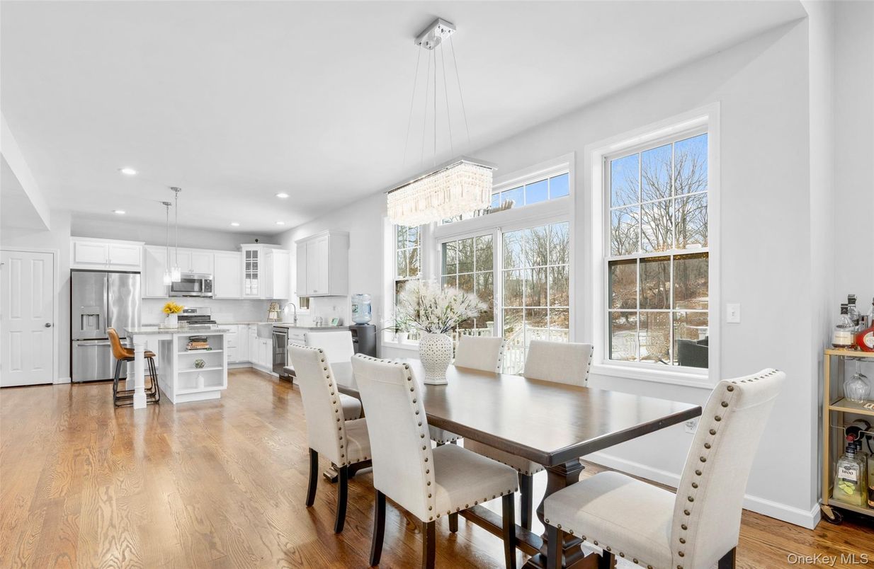 Chandelier, Dining room, Interior, Kitchen, Pendant Lights, Recessed Lighting, Stainless Steel Appliances, Wood Texture Flooring