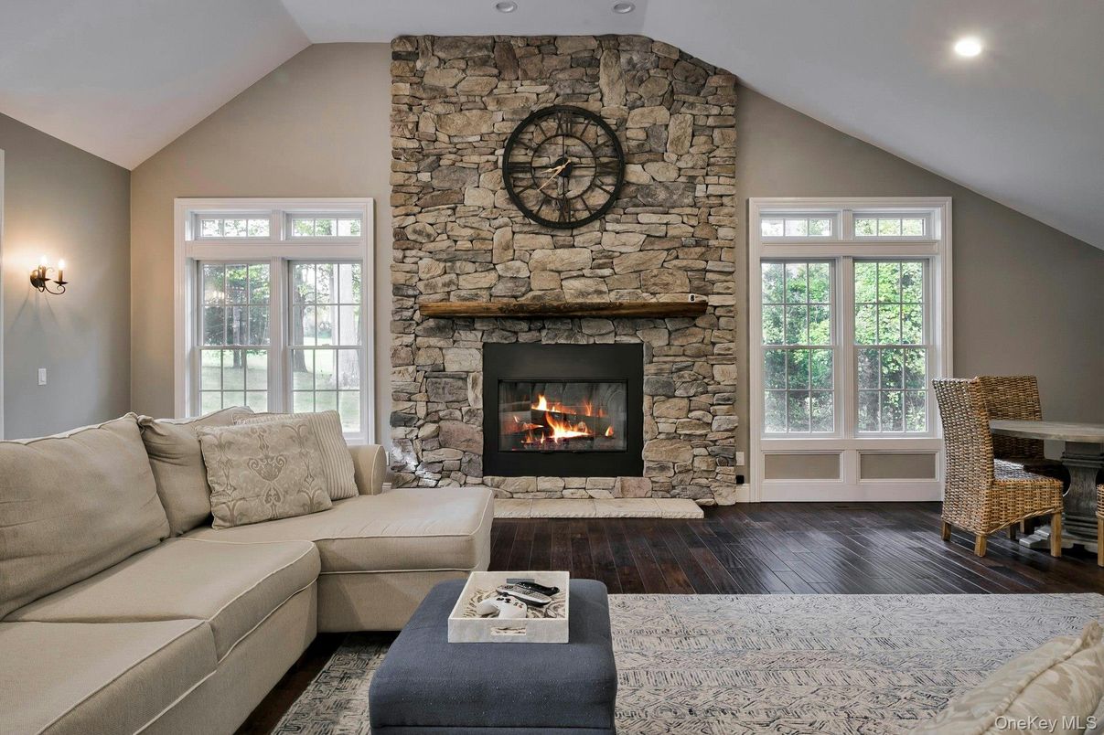 Fireplace, Interior, Living room, Recessed Lighting, Stone Walls, Wood Texture Flooring