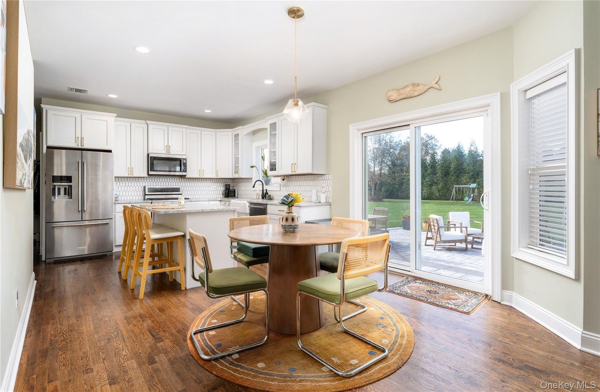 Dining room, Interior, Kitchen, Pendant Lights, Recessed Lighting, Stainless Steel Appliances, Wood Texture Flooring