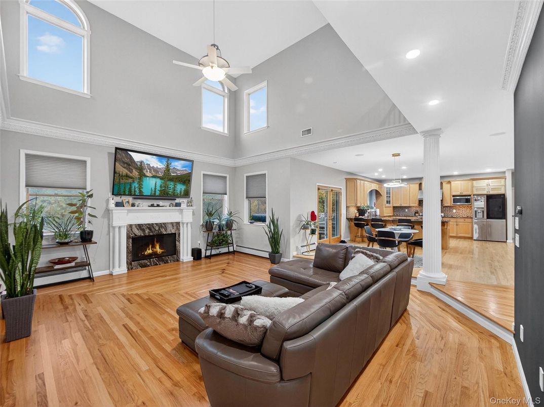 Dining room, Fireplace, Interior, Kitchen, Living room, Pendant Lights, Recessed Lighting, Stainless Steel Appliances, Wood Texture Flooring