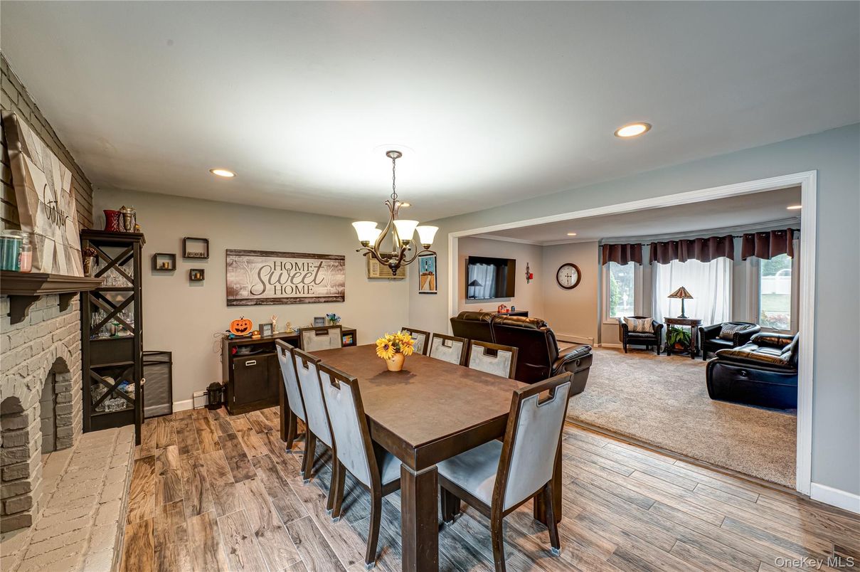 Chandelier, Dining room, Fireplace, Interior, Living room, Recessed Lighting, Wood Texture Flooring