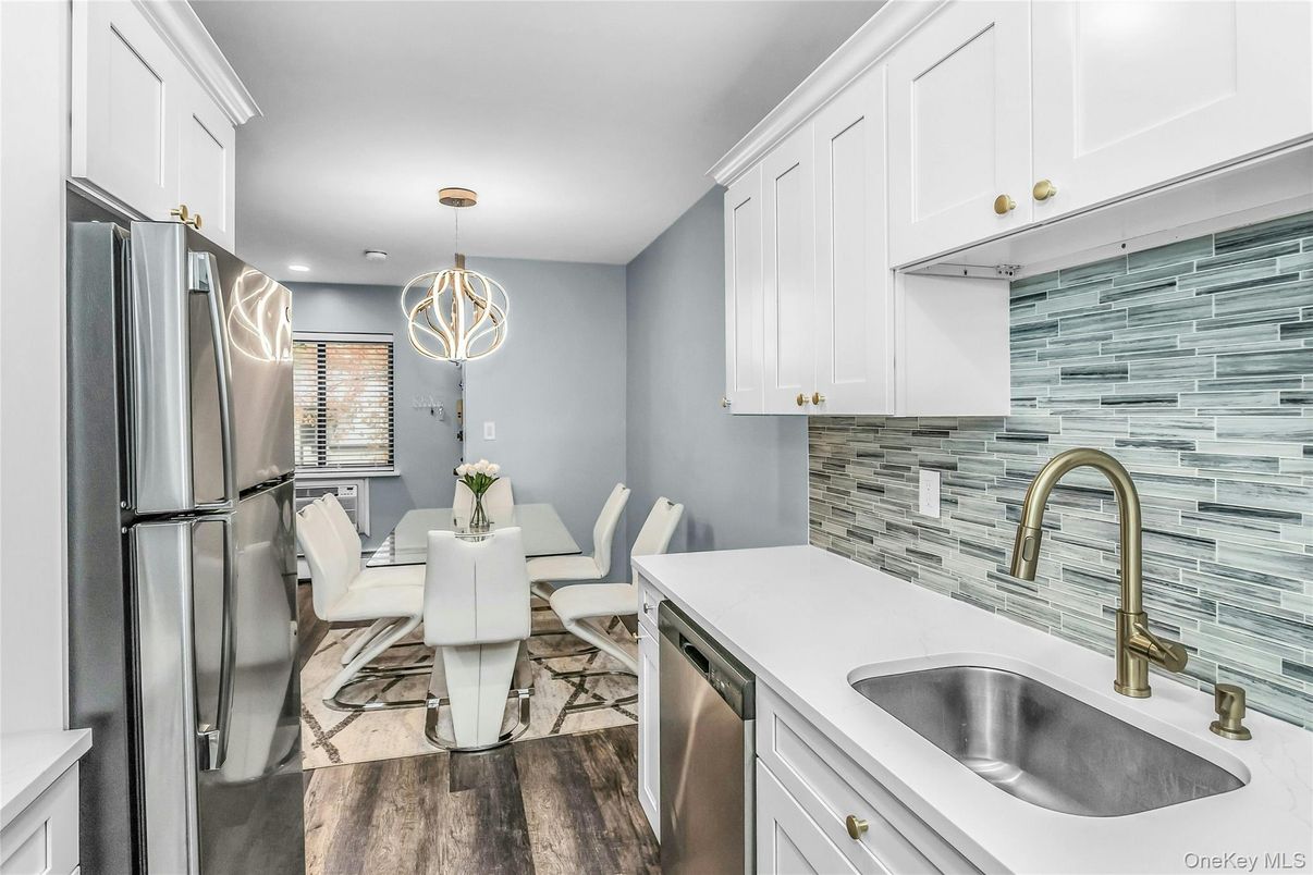 Dining room, Interior, Kitchen, Pendant Lights, Recessed Lighting, Stainless Steel Appliances, Wood Texture Flooring